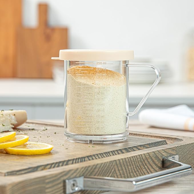 Restaurantware RW Base 10 Ounce Clear Plastic Dredge Spice Shaker 1 Reusable Dry Rub Shaker - Includes Beige Perforated Lid With Handle Clear Polycarbonate Spice Shaker For Fine Seasonings